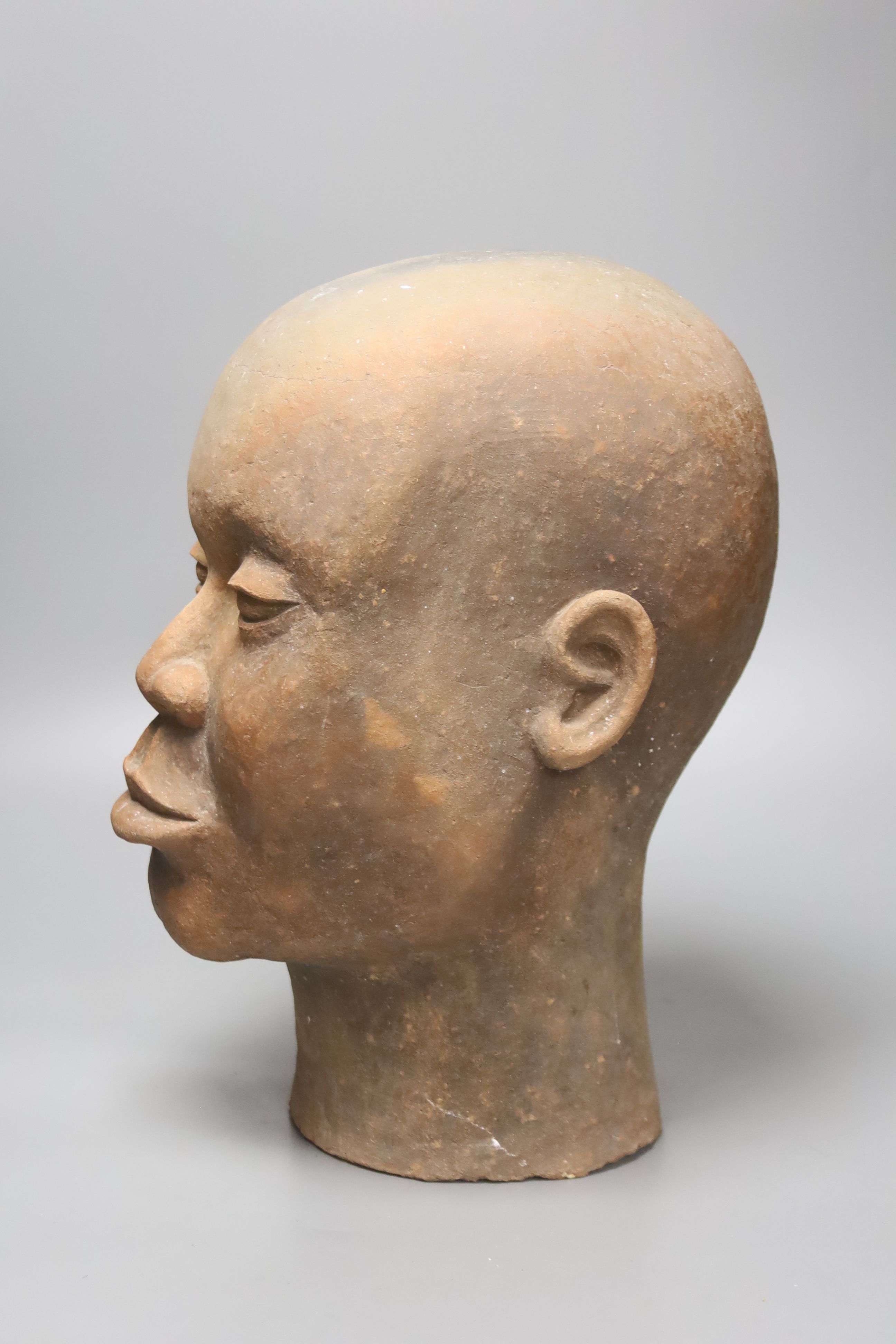 A large decoative terracotta head, 33cm high